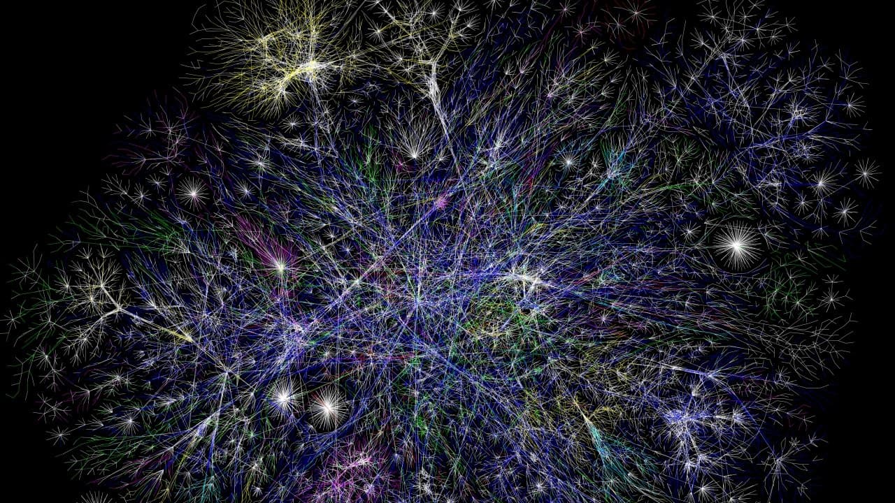 A map of internet connections, drawn as thousands of glowing coloured lines on a black background