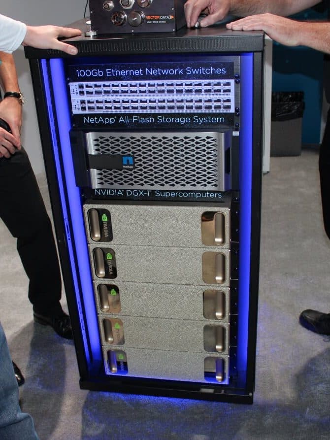 A rack with NetApp all-flash storage and NVIDIA DGX-1 systems connected through 100 Gb Ethernet switches, shown at a trade show