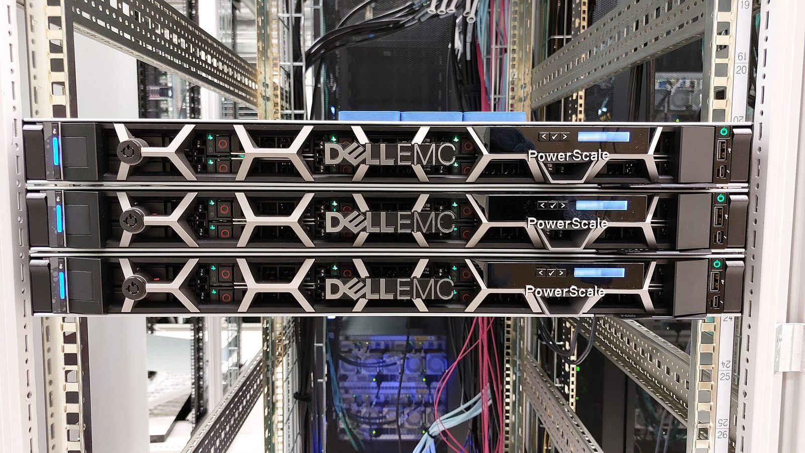 Three Dell PowerScale F600 storage nodes mounted in a rack, with cabling behind them