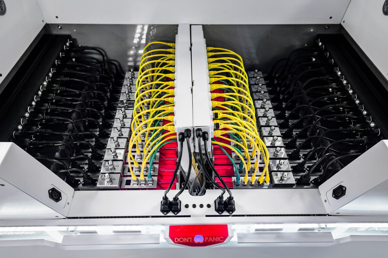 Top view of an Asperitas AIC24 immersion system with server modules submerged in fluid and yellow fibre cabling